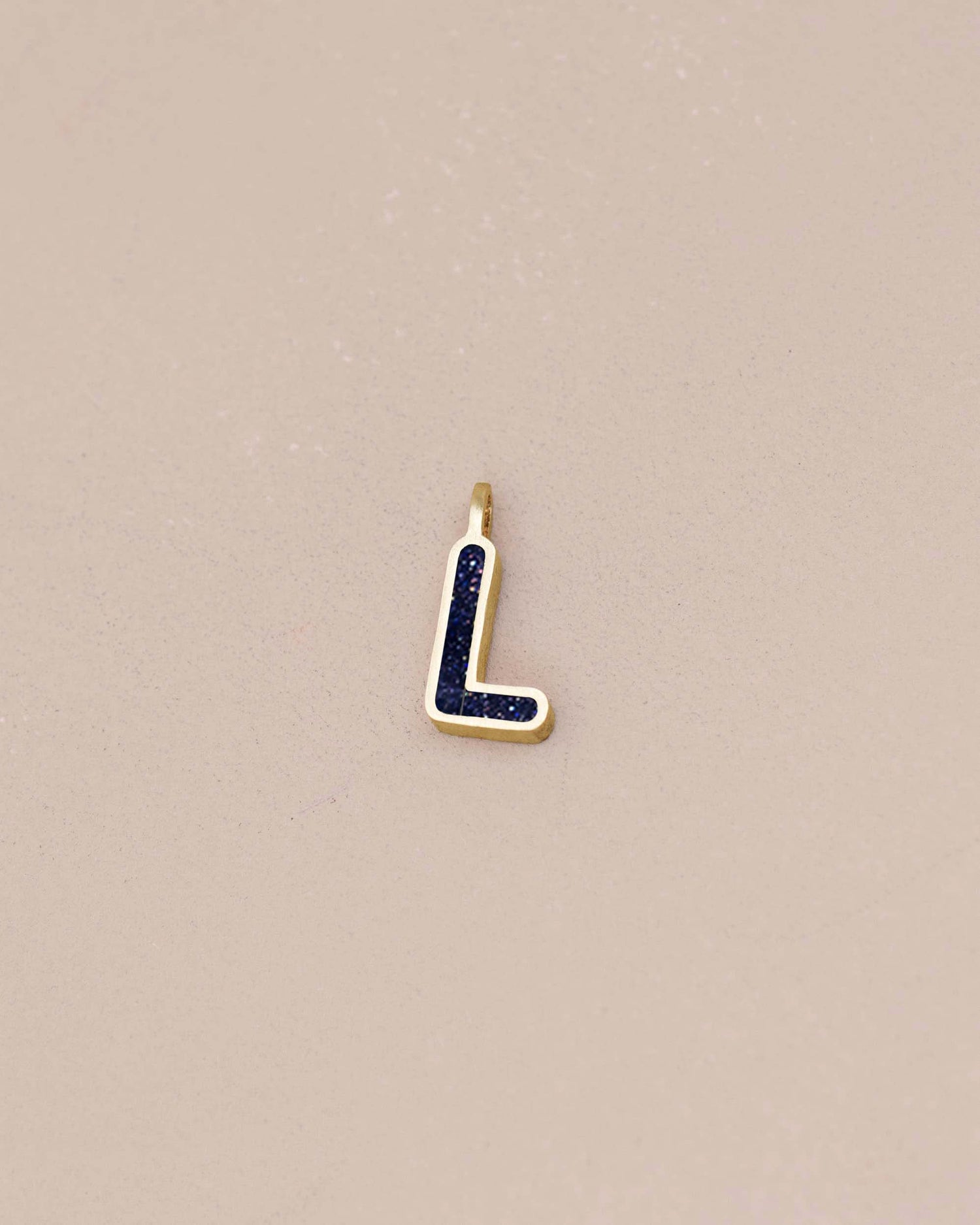 Gold and blue letter &