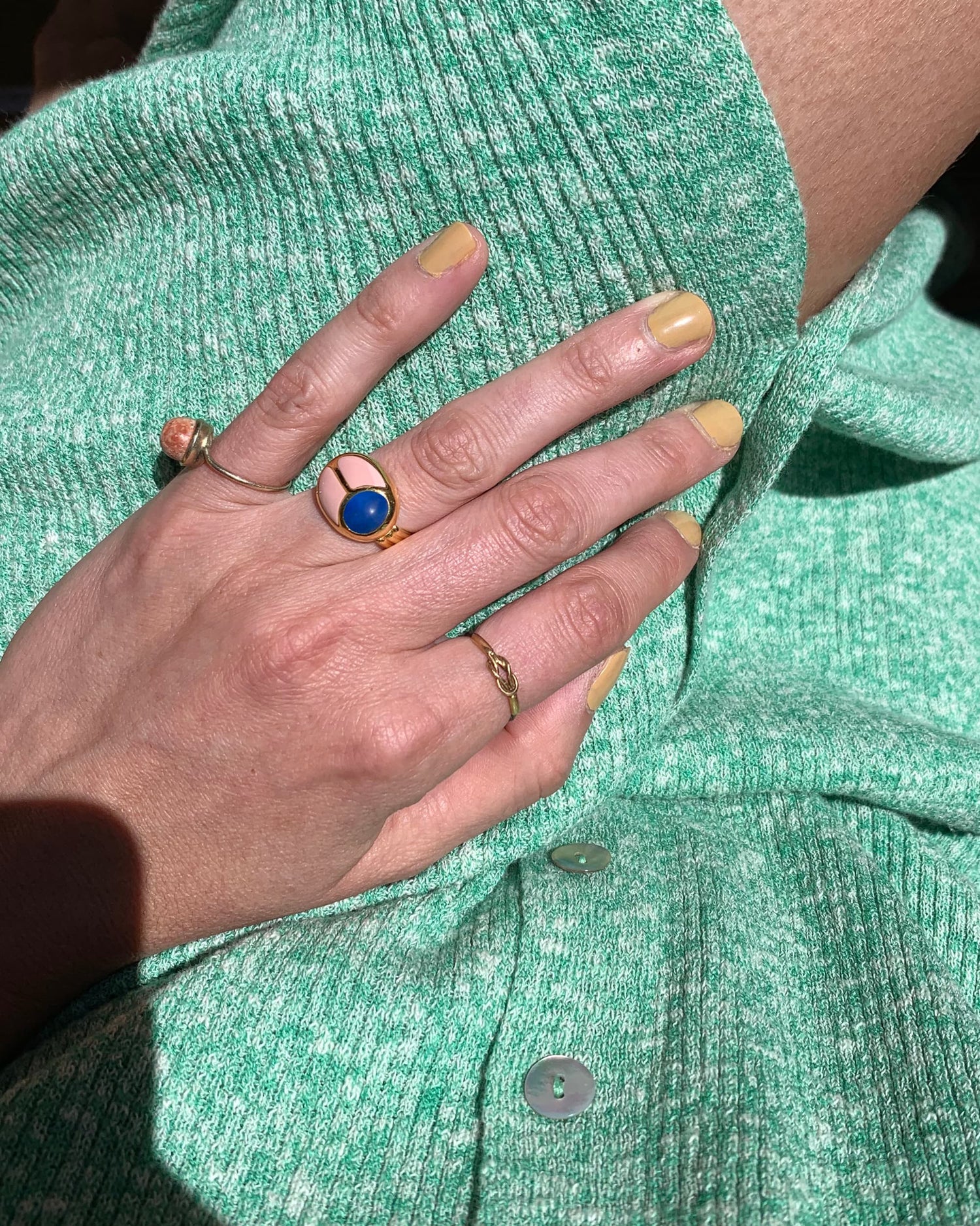 hand wearing a scarab ring