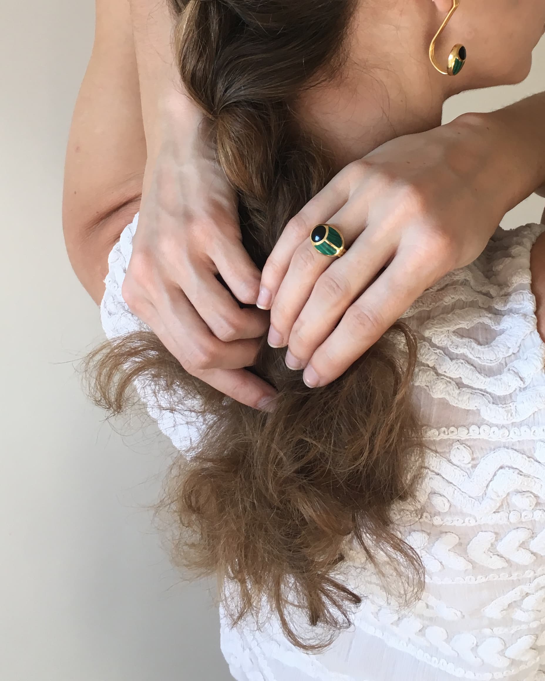 scarab ring worn by model