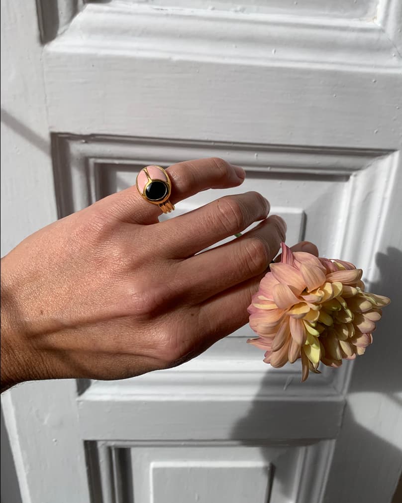 scarab ring with pink opal and onyx on hand