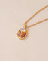 A one-of-a-kind SunRa Medal with moonstone and ocean jasper inlays, vermeil-plated, displayed on a gold-toned snake chain with a lobster clasp.