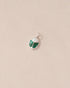 A silver charm featuring a miniature scarab amulet design with jelly opal and malachite inlay, displayed against a neutral background.