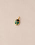 A gold charm featuring a scarab design with onyx and malachite inlays, displayed against a neutral background.