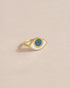 A 14K yellow gold ring with an eye-shaped starry opal talisman.