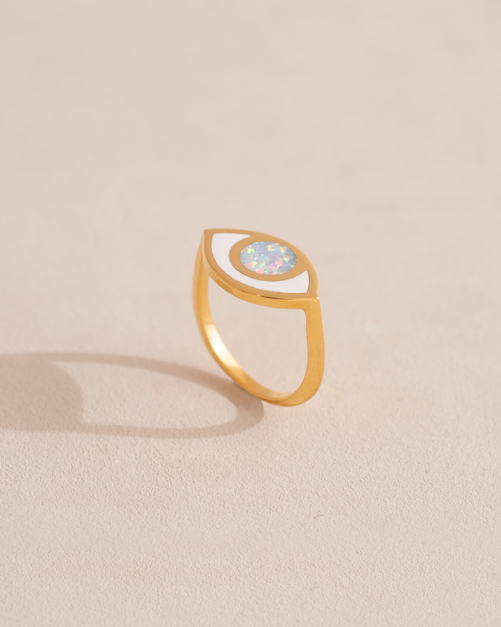 gold eye ring inlaid with opal