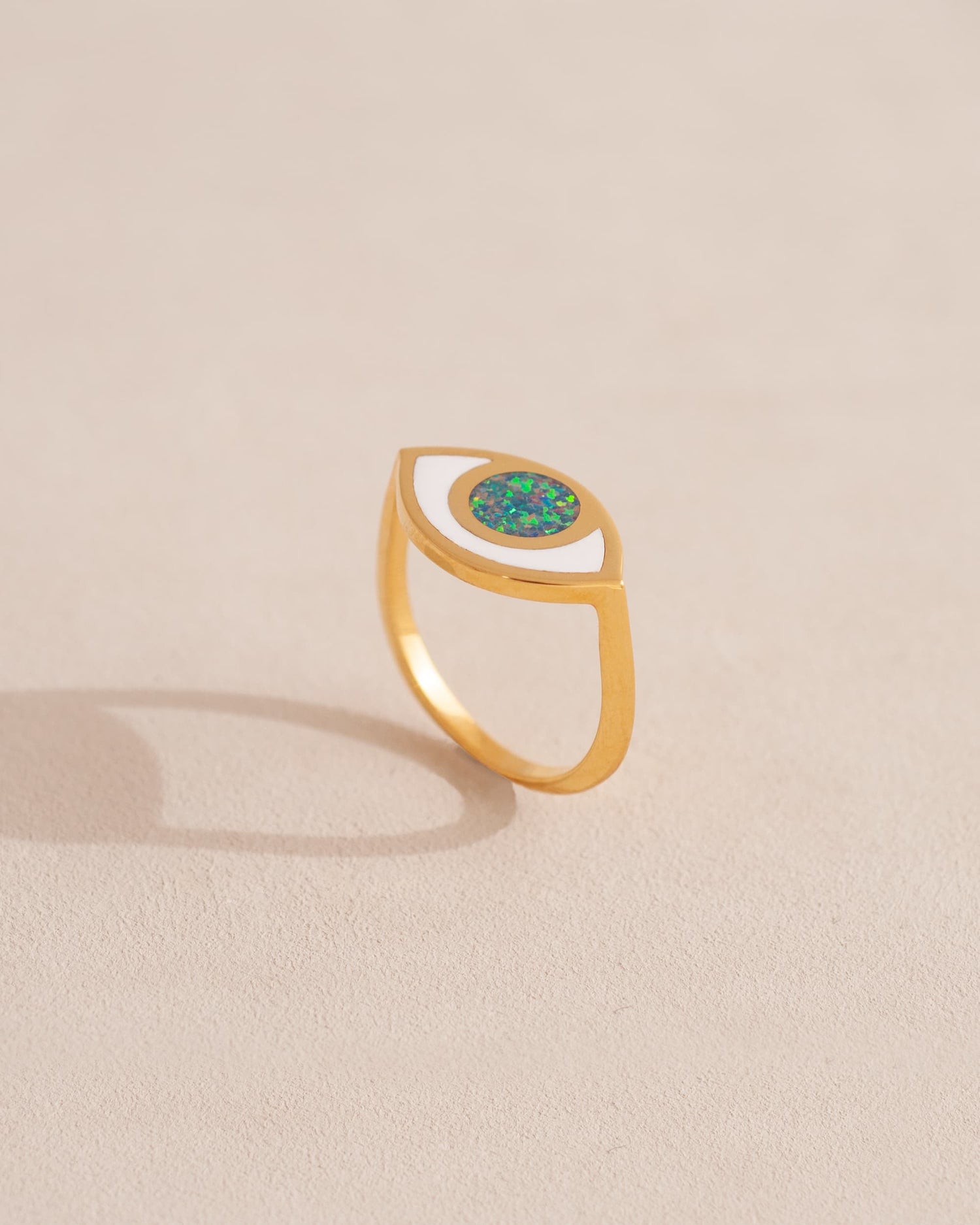 gold eye ring inlaid with dark opal