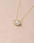 A 14K yellow gold pendant necklace with an eye-shaped design made of opal, displayed against a light background.