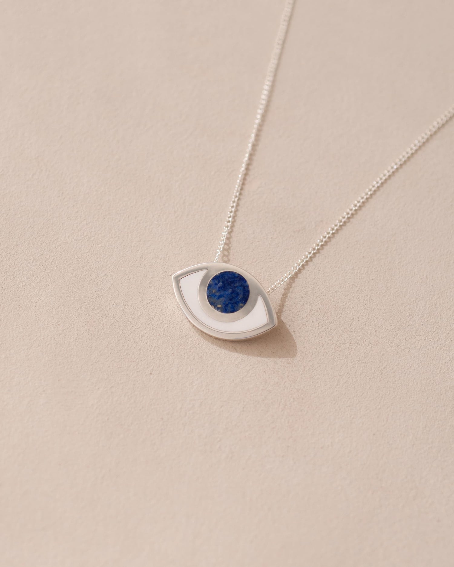 silver eye pendant inlaid with lapis lazuli with silver chain
