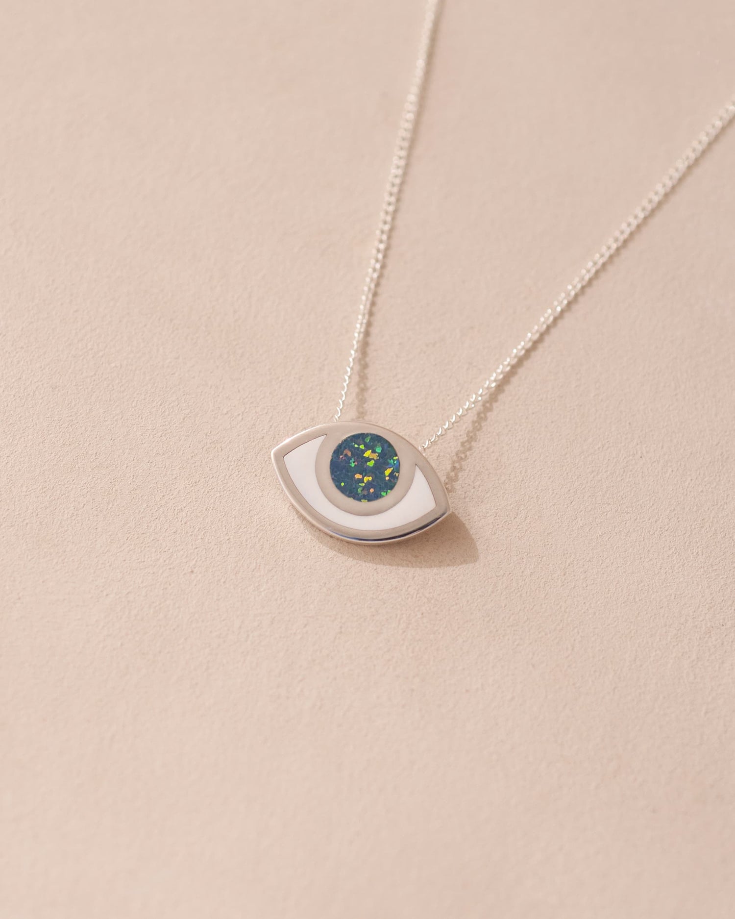silver eye pendant inlaid with opal with silver chain