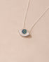 silver eye pendant inlaid with opal with silver chain
