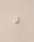 a silver charm shaped like an eye featuring a round opal center