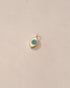 A small 14K yellow gold charm with a starry opal eye design on a light background.