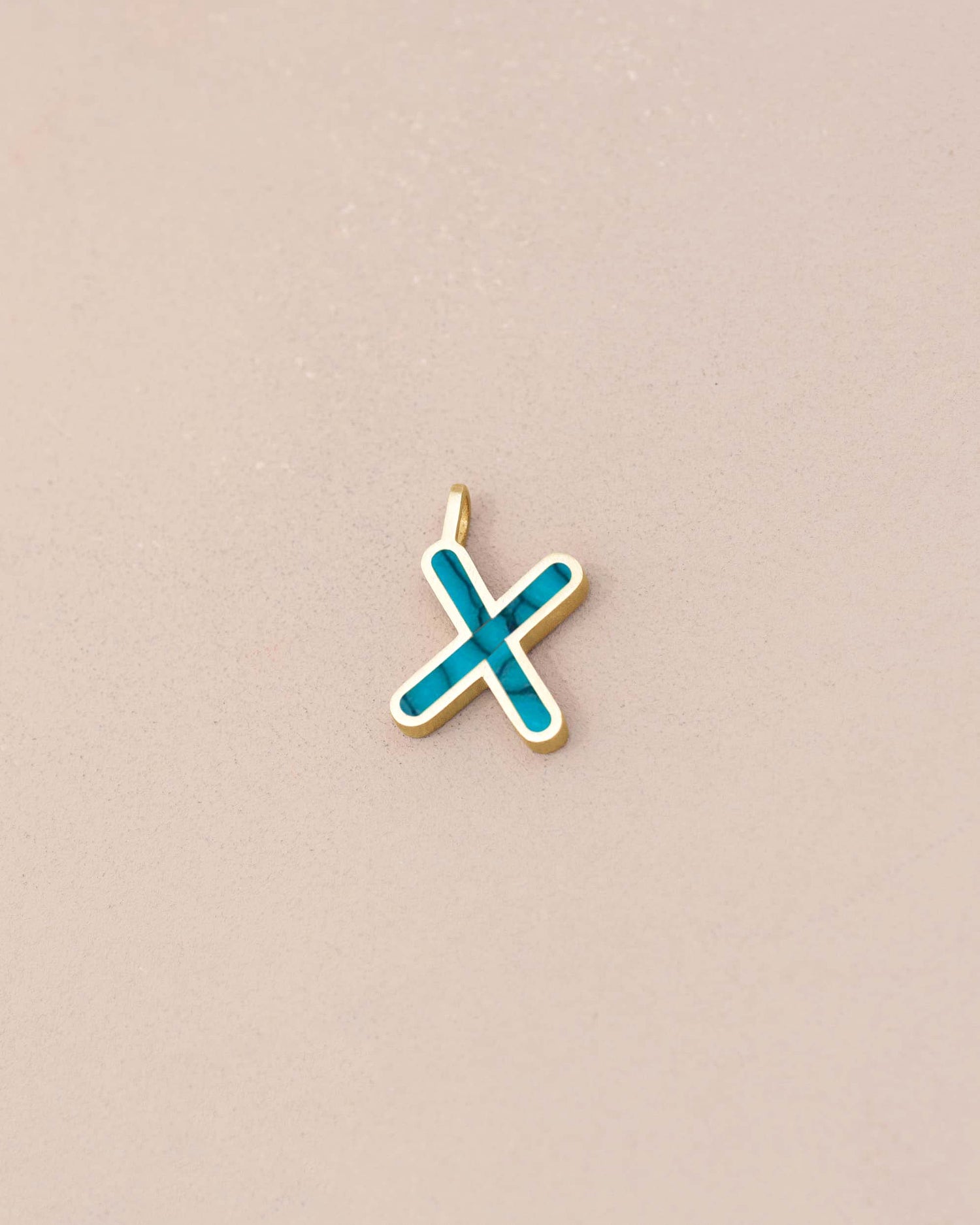 Gold pendant with a blue &