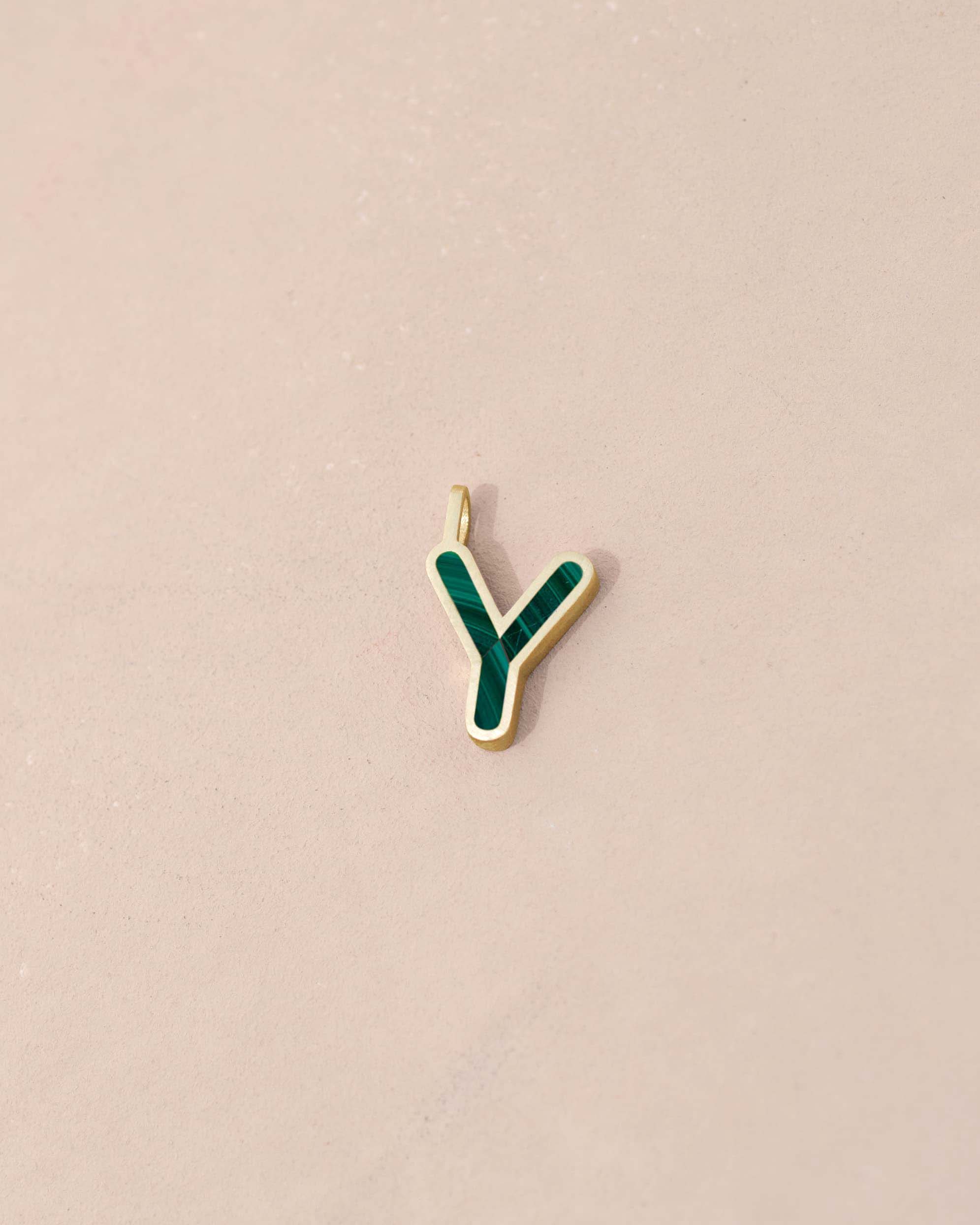 Gold and green letter &