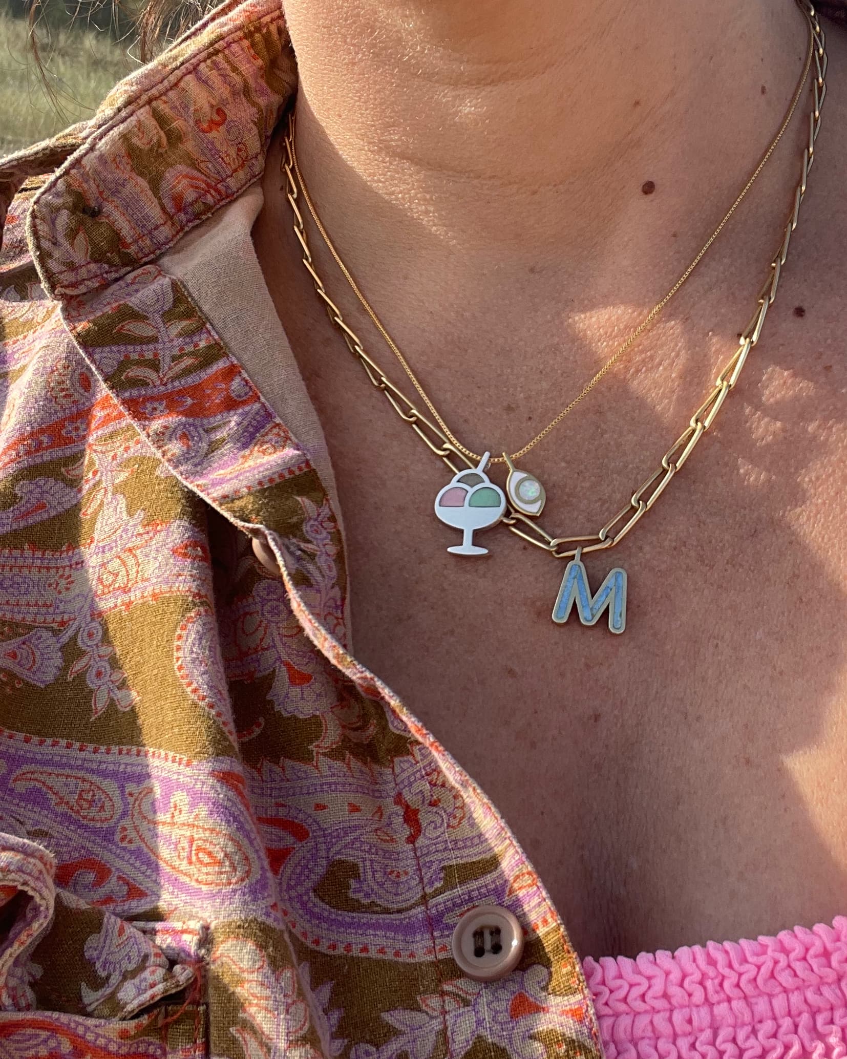 Necklace with charms and a letter &