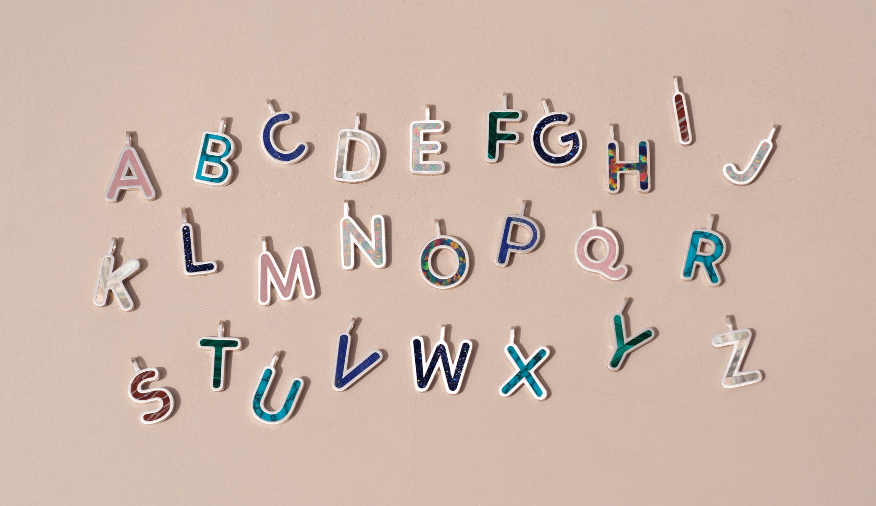 Colorful alphabet letters on a beige background