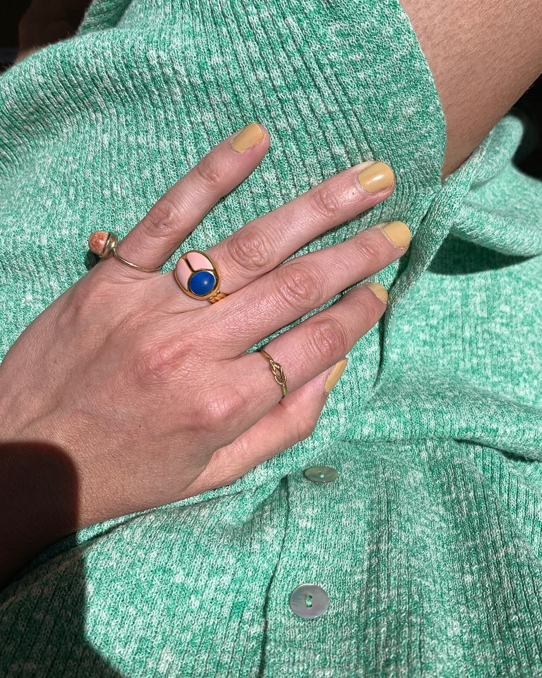 hand wearing a scarab ring