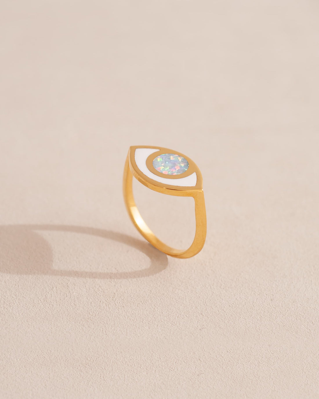 gold eye ring inlaid with opal