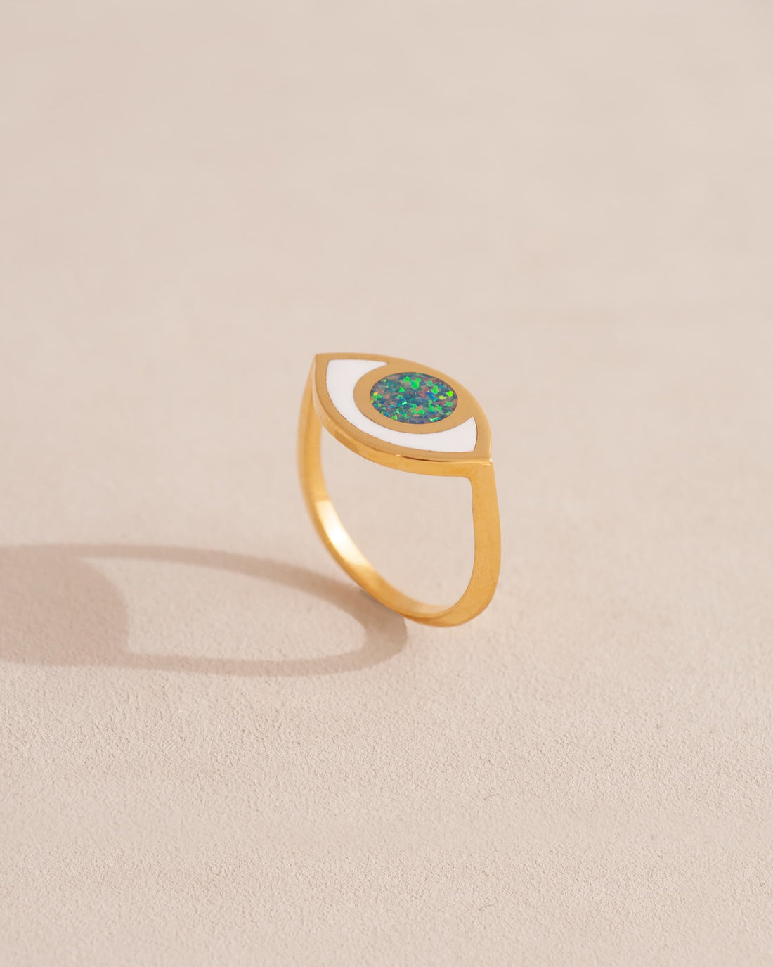 gold eye ring inlaid with dark opal