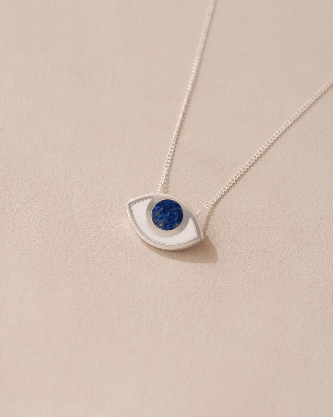 silver eye pendant inlaid with lapis lazuli with silver chain