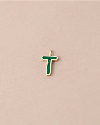 Gold pendant with green enamel letter &