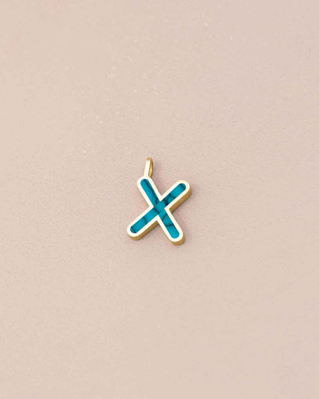 Gold pendant with a blue &