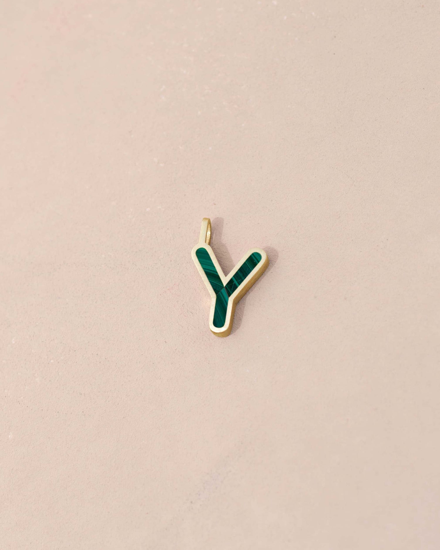 Gold and green letter &