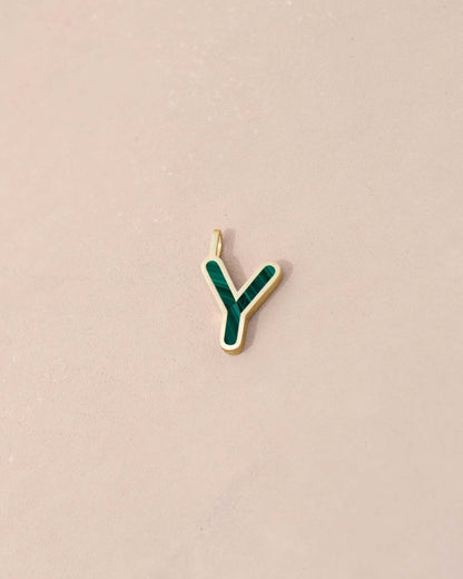 Gold and green letter &