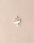 Decorative pendant with a pink and green design on a beige background